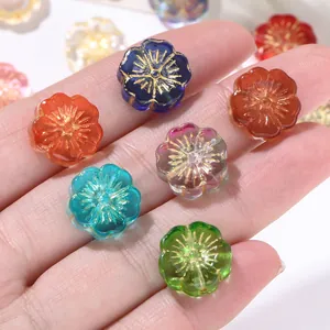 Close-up detail of colorful vintage gold-traced glass flower beads for DIY jewelry