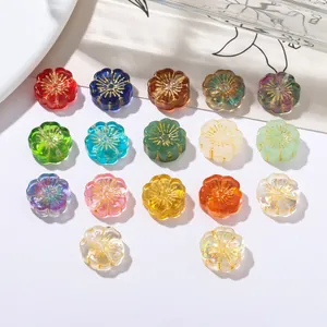 Detailed view of vintage gold-rimmed flower glass beads in various colors for DIY jewelry.