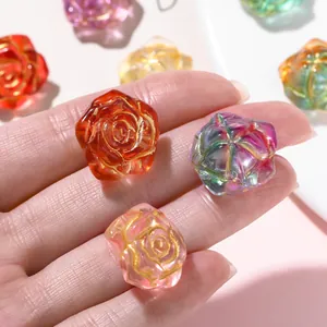 Macro detail of ice-transparent 3D rose beads with elegant gold-painted edges.