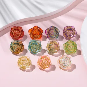 Detailed view of colorful ice-transparent glass rose beads with gold-traced edges