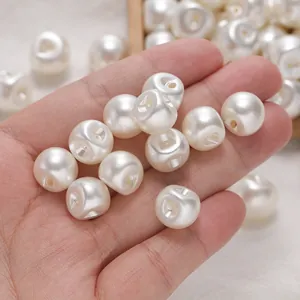 Detailed close-up showing white round ABS imitation pearl buttons with a side-hole design