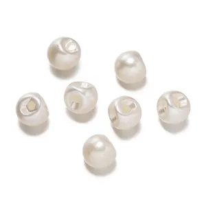 Close-up detail of round ABS faux pearl buttons with hidden side holes for women's shirts