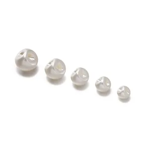 Detail of round ABS faux pearl shank buttons in varying sizes for sewing