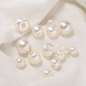 Detailed view of glossy ABS imitation pearl buttons with hidden shank holes.