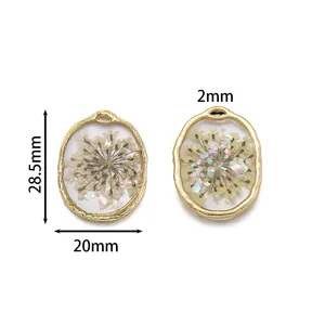 Gold oval alloy pendant with dried flowers and iridescent flakes for DIY jewelry making