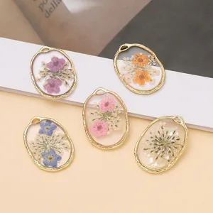Handmade dried flower resin pendants with gold alloy frames for DIY jewelry making