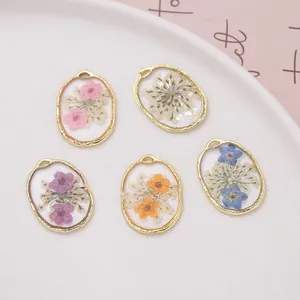Assorted oval real dried flower resin pendants for DIY jewelry making with gold frames