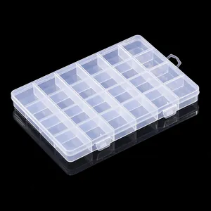 Macro view of a 24-compartment transparent plastic organizer with double secure latches