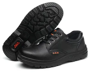 Black leather men's safety work shoes showing anti-slip tread pattern and side profile
