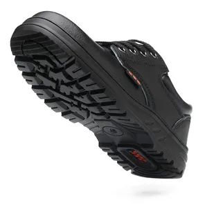 Detailed bottom view of a black safety shoe highlighting its durable anti-slip sole tread