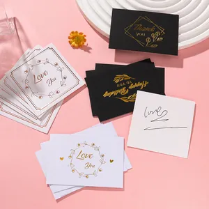 Elegant gold-stamped greeting cards with thank you and love messages on pink background