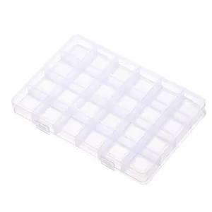 Detailed macro view showing the 28 fixed compartments of the clear plastic storage box