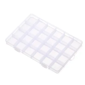 Detail view of 24-compartment transparent plastic storage box for jewelry organization.