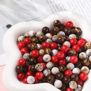 Close-up of vibrant marble effect acrylic beads for DIY handmade jewelry making crafts