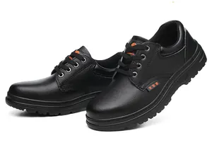 Close-up of durable black men's safety work shoes featuring anti-smashing steel toes