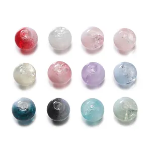 Detailed view of colorful mixed glass beads for DIY jewelry making and phone chains.