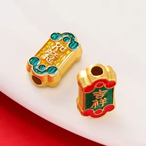 Detailed macro shot of Chinese style gold plated enamel beads with auspicious lucky characters