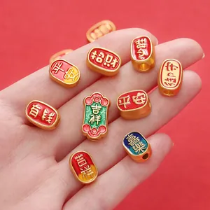 Detailed view of Chinese style matte gold blessing beads with colorful enamel for DIY jewelry