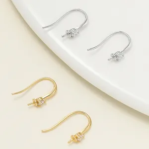 Detail shot of 18k gold-plated S925 sterling silver earring hooks with zircon accents.