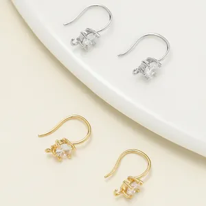 Detail shot of 18k gold and silver plated DIY earring hooks with clear faceted stones.