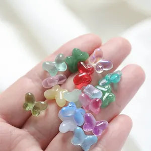Macro view of assorted colorful translucent butterfly glass beads for DIY jewelry making