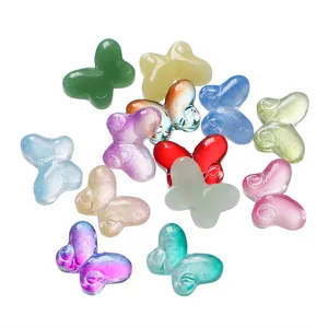 Detailed view of assorted colorful glass butterfly beads for DIY jewelry making and crafts