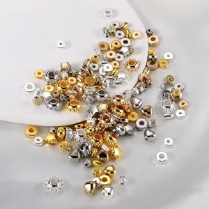 Close-up detail of mixed gold and silver CCB beads in star heart and oval shapes for DIY crafts