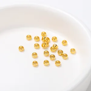 Bulk gold plated stainless steel crimp beads for DIY jewelry findings and crafts.