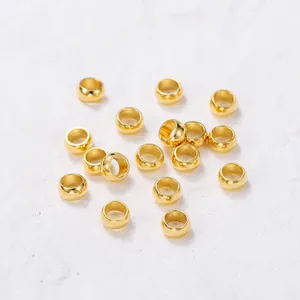 Macro shot of gold-plated stainless steel round spacer beads for DIY jewelry making