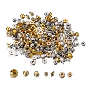 Detailed view of mixed gold and silver CCB beads in heart, star, and oval shapes
