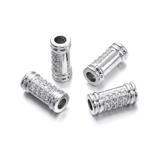 Detailed macro view of silver micro-pave cubic zirconia cylindrical jewelry connector beads.