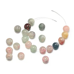 Detailed macro view of 10mm colorful floral glass beads with opal texture for DIY jewelry