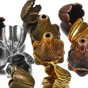Assorted vintage alloy flower bud bead caps in antique gold and silver for DIY jewelry