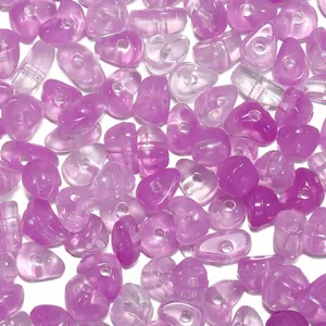 Close-up macro of purple marble-textured acrylic beads for DIY jewelry craft making