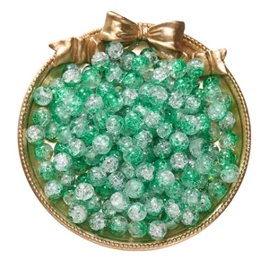 Detail view of green crackle glass beads for DIY bracelet and necklace making.