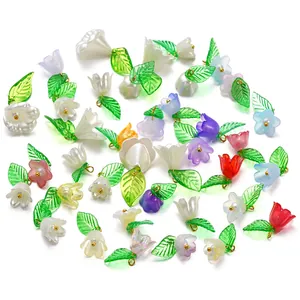 Detail showing various colorful acrylic flower and leaf pendants for DIY jewelry making.