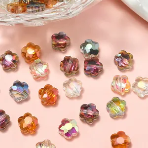 Cuentas de flores de cristal tallado en colores aurora variados