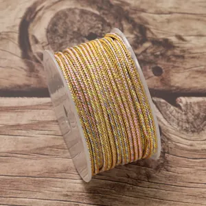 Detailed macro view of 2.5mm multi-color braided ruyi jewelry cord on a clear plastic spool.