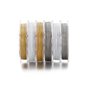 Selection of Japanese steel beading wires in gold, silver, and grey for DIY jewelry