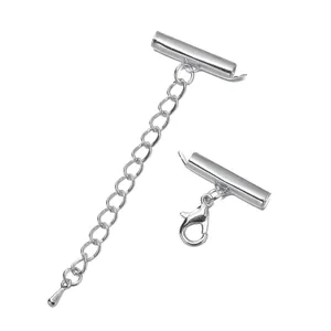 Macro view of silver jewelry slide tube ends with lobster clasp and extension chain.