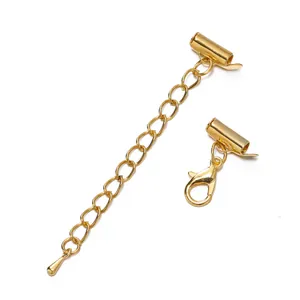 Detailed view of gold-plated slide tube clasp set with extender chain and lobster clasp.