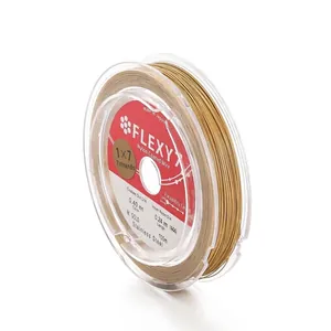 Detail view of 0.40mm gold nylon coated stainless steel beading wire spool for DIY jewelry.