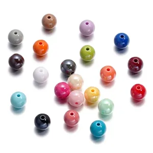 Close-up macro view of colorful 10mm acrylic round beads for DIY jewelry making.
