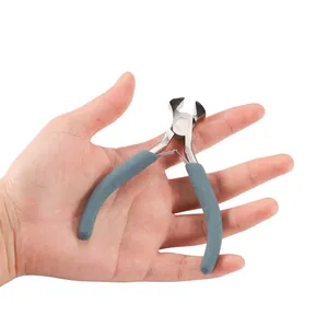 Detailed macro view of a handheld five inch mini jewelry end cutting pliers craft tool