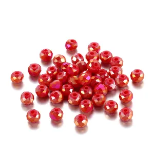 Macro view of sparkling red faceted glass crystal beads for jewelry making and DIY crafts.