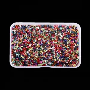 Box of colorful irregular crushed glass stones for DIY nail art crafts