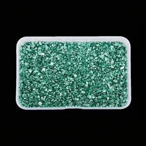 Detailed view of high-gloss irregular green crushed glass stones in a clear storage box