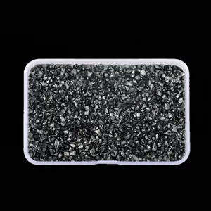 Close-up of black high-gloss glass crushed stones for DIY jewelry and nail art