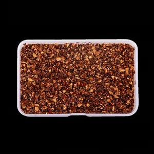 Close-up detail of metallic bronze irregular crushed glass stones for DIY nail art decorations
