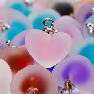 Macro view of colorful frosted acrylic heart charms for handmade jewelry projects